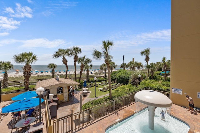 view of swimming pool featuring a water view