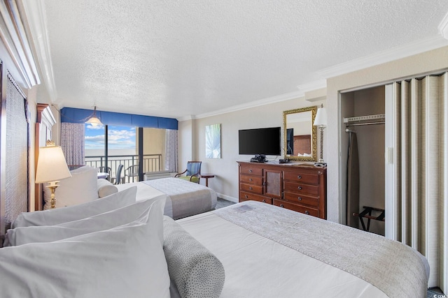 bedroom featuring crown molding, a textured ceiling, access to exterior, and a closet