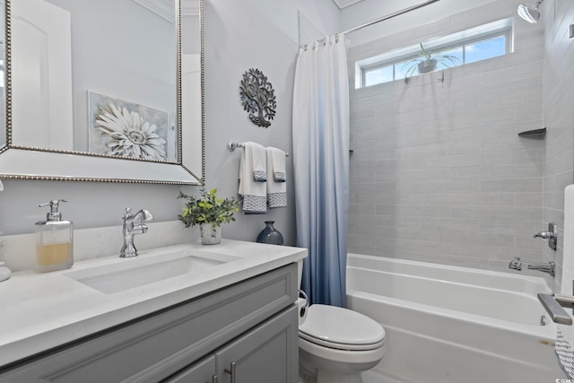 full bathroom featuring toilet, vanity, and shower / bath combination with curtain