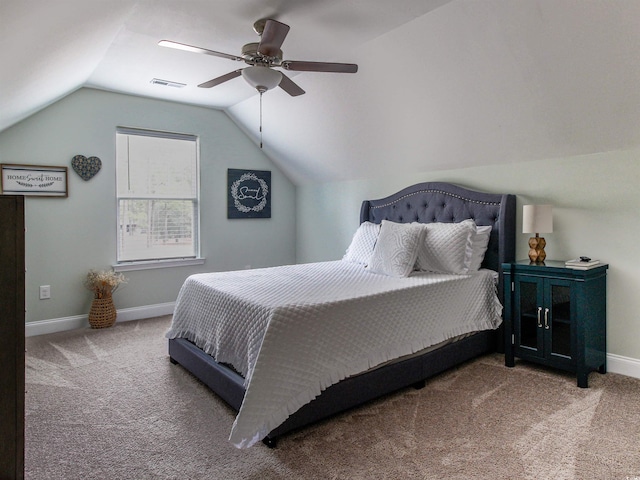 bedroom with visible vents, baseboards, a ceiling fan, lofted ceiling, and carpet flooring