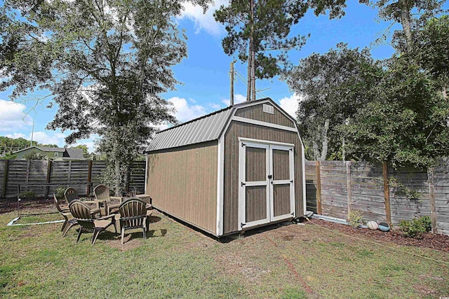 view of shed with a fenced backyard