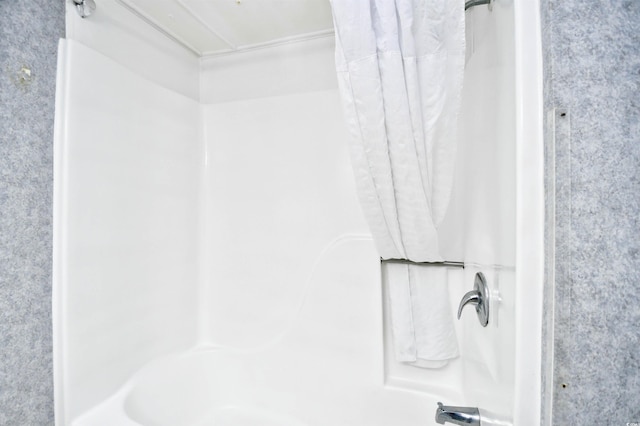 bathroom featuring shower / tub combo with curtain