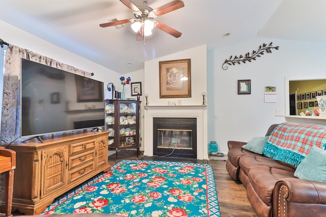 living room featuring ceiling fan, lofted ceiling, and hardwood / wood-style floors