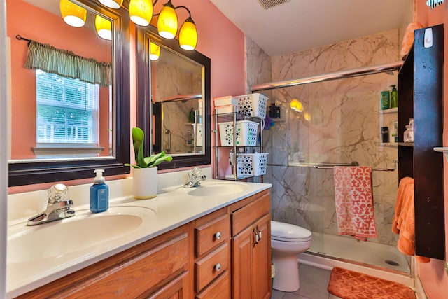 bathroom with toilet, walk in shower, vanity, and tile patterned floors