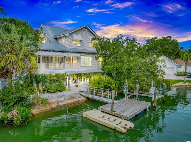 dock area featuring a water view