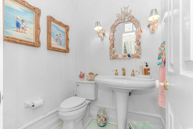 bathroom featuring toilet and tile patterned floors