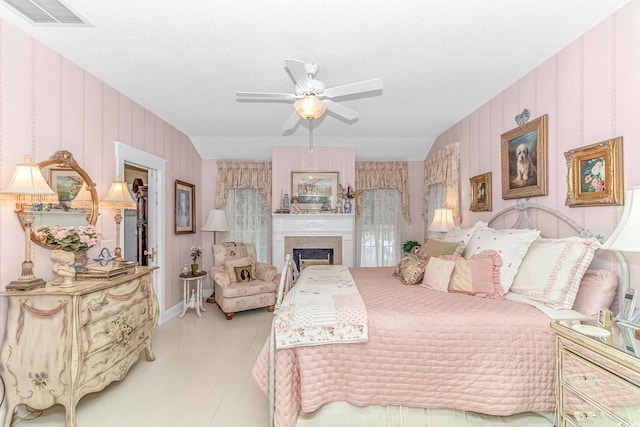 bedroom with light hardwood / wood-style flooring and ceiling fan