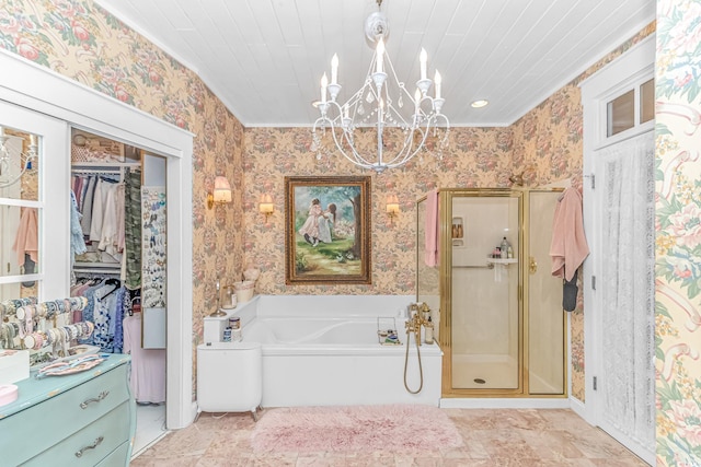 bathroom featuring shower with separate bathtub, a notable chandelier, and vanity