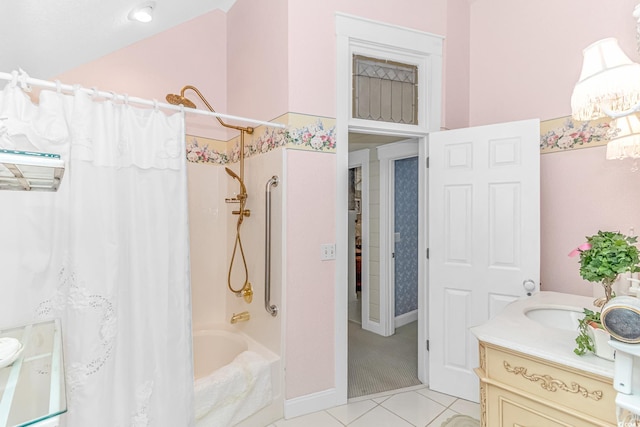 bathroom featuring tile patterned flooring, vanity, shower / bath combo with shower curtain, and vaulted ceiling