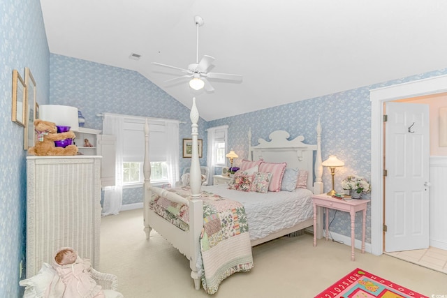 bedroom featuring light carpet, vaulted ceiling, and ceiling fan