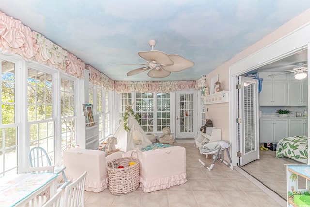 sunroom featuring ceiling fan and a healthy amount of sunlight