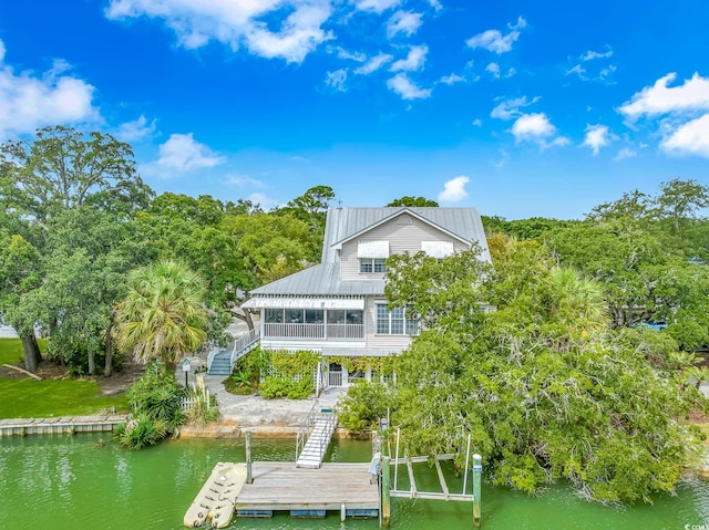 rear view of property featuring a water view