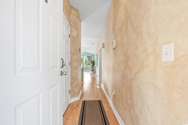 hallway with light wood-type flooring