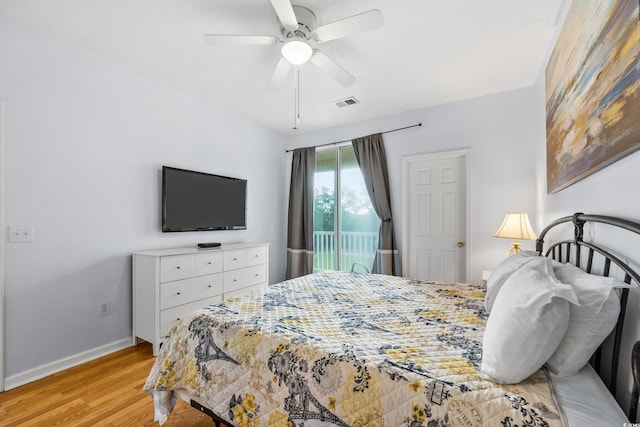 bedroom featuring visible vents, light wood-style flooring, a ceiling fan, and baseboards