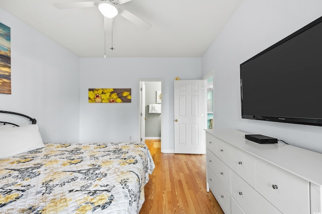 bedroom with light wood-style flooring and a ceiling fan