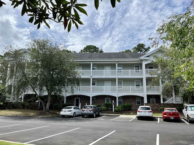 view of property with uncovered parking