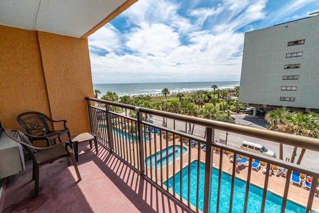 balcony featuring a water view