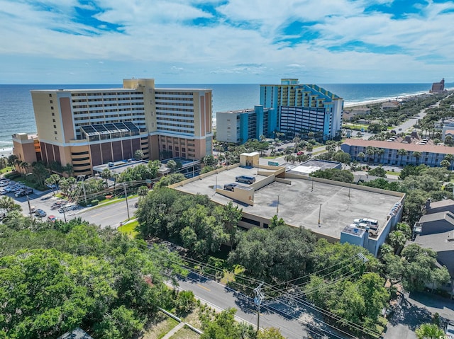 birds eye view of property featuring a city view and a water view