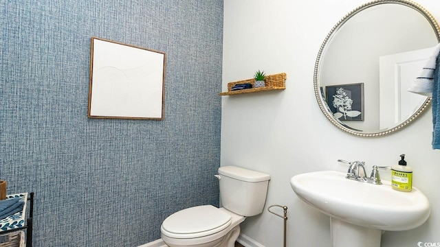 bathroom with toilet and sink