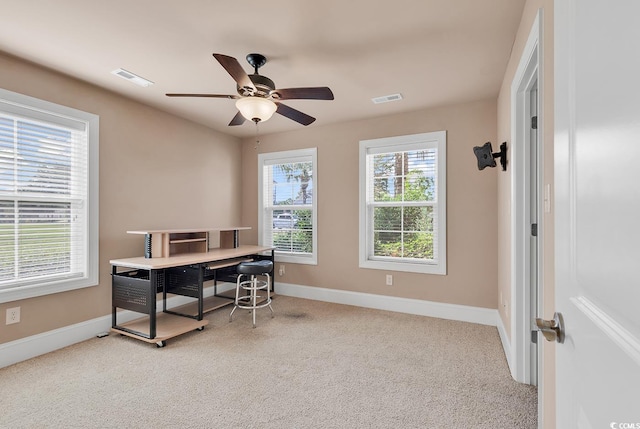 home office featuring ceiling fan and light colored carpet