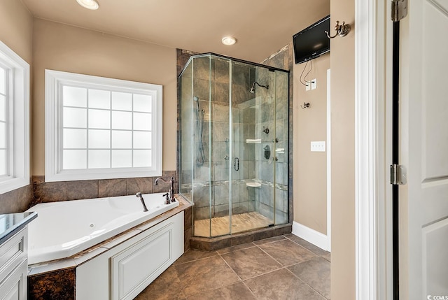 bathroom featuring tile patterned flooring, vanity, and independent shower and bath