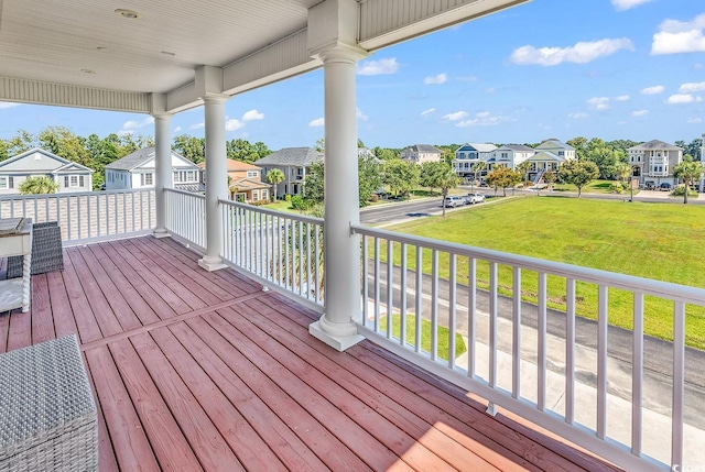 wooden deck with a yard