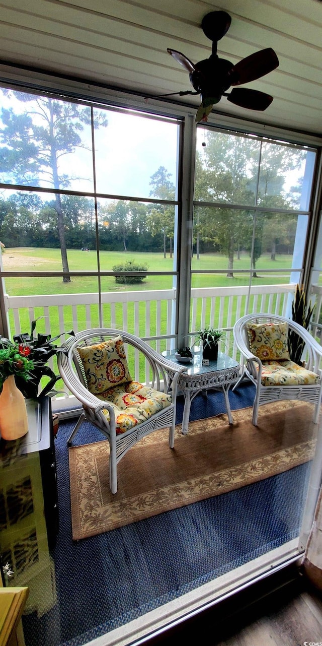 sunroom / solarium with ceiling fan