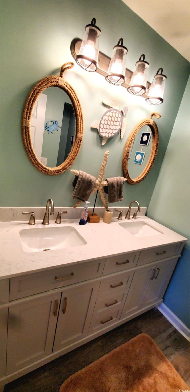 bathroom with wood-type flooring and vanity