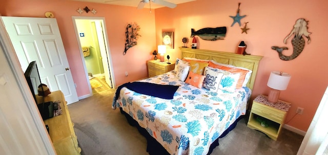 bedroom featuring carpet floors, ensuite bath, and ceiling fan