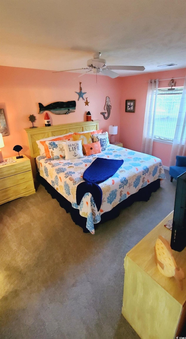 carpeted bedroom with ceiling fan