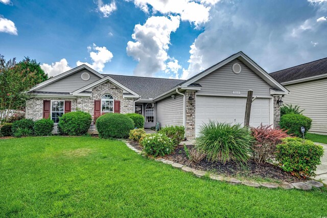 ranch-style home featuring a garage and a front lawn