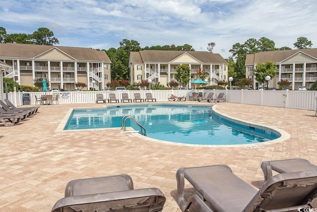 view of swimming pool featuring a patio