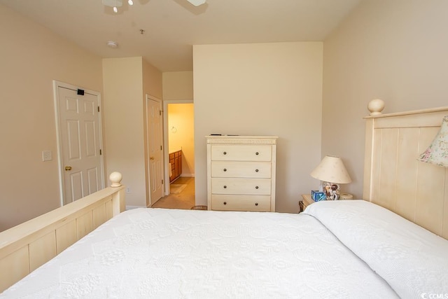 bedroom featuring connected bathroom and ceiling fan