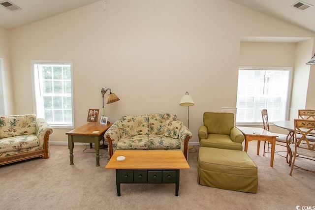 living room with lofted ceiling and carpet