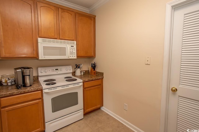 kitchen featuring ornamental molding, white appliances, and light tile patterned flooring