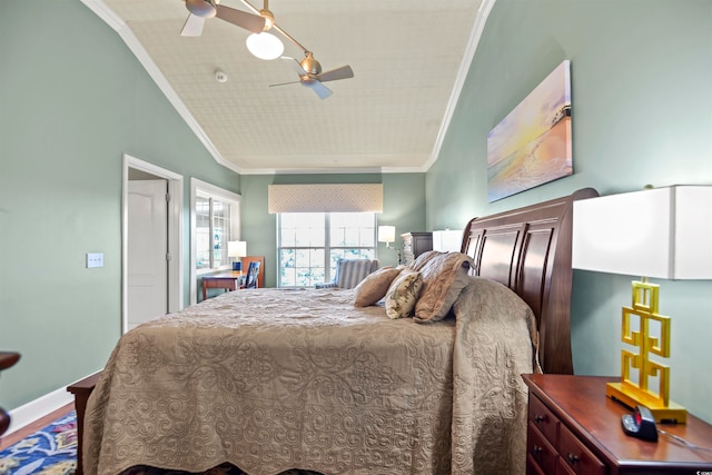 bedroom with ceiling fan, hardwood / wood-style floors, and ornamental molding