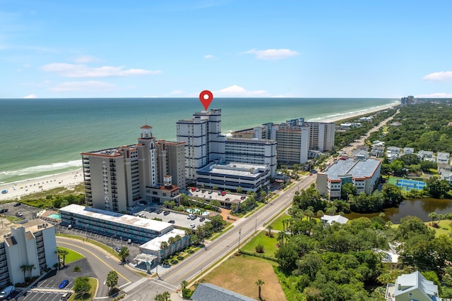 birds eye view of property featuring a view of the beach and a water view