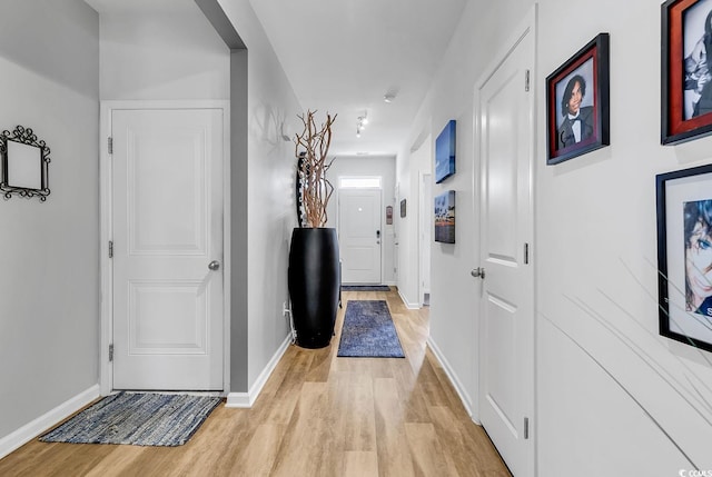 hall with light wood-type flooring