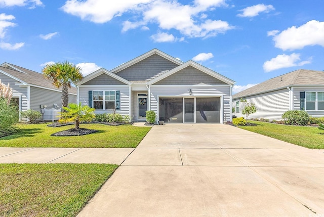 view of front of home with a garage and a front lawn