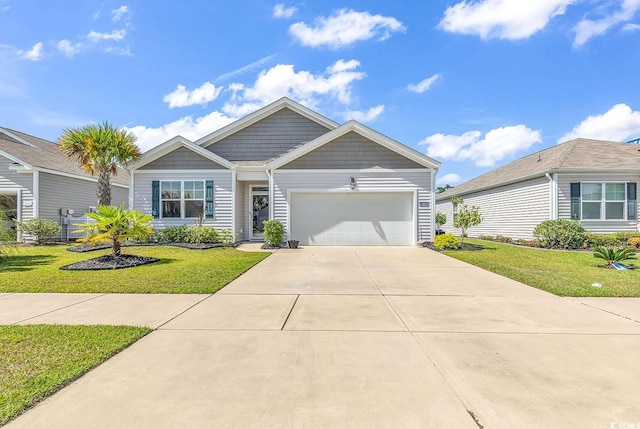 view of front of property featuring a garage and a front lawn