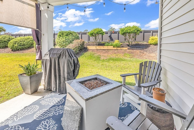 view of patio / terrace with an outdoor fire pit