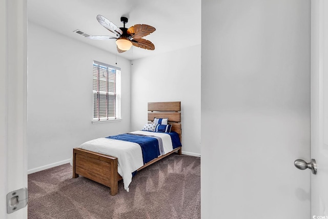 bedroom featuring ceiling fan and carpet