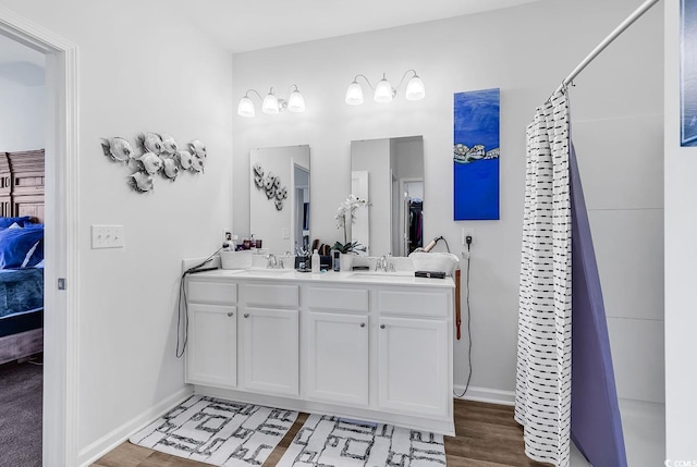 bathroom featuring a shower with curtain, wood-type flooring, and vanity