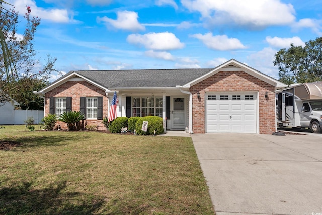 ranch-style home with a garage and a front lawn