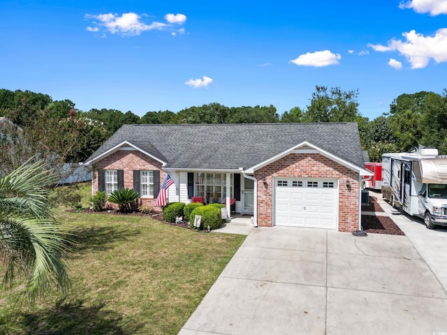 single story home featuring a front lawn and a garage