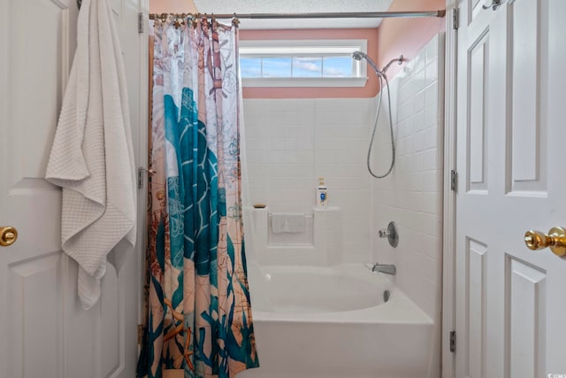 bathroom with shower / bath combination with curtain