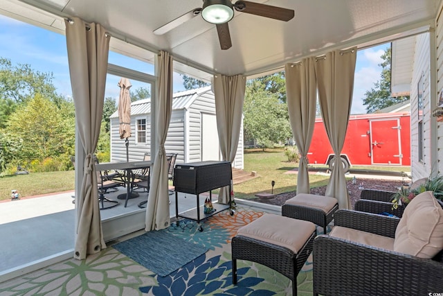 sunroom / solarium featuring ceiling fan