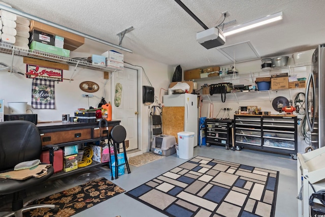 garage featuring a garage door opener and a workshop area