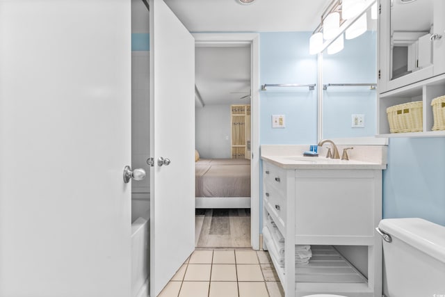 bathroom with vanity, toilet, and wood-type flooring