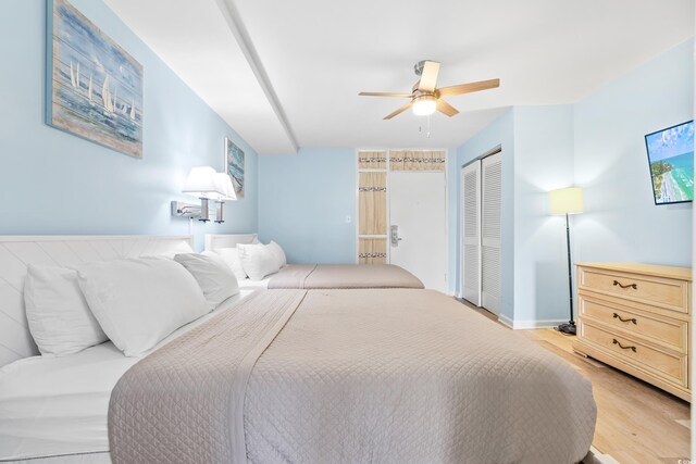 bedroom featuring ceiling fan and light hardwood / wood-style floors